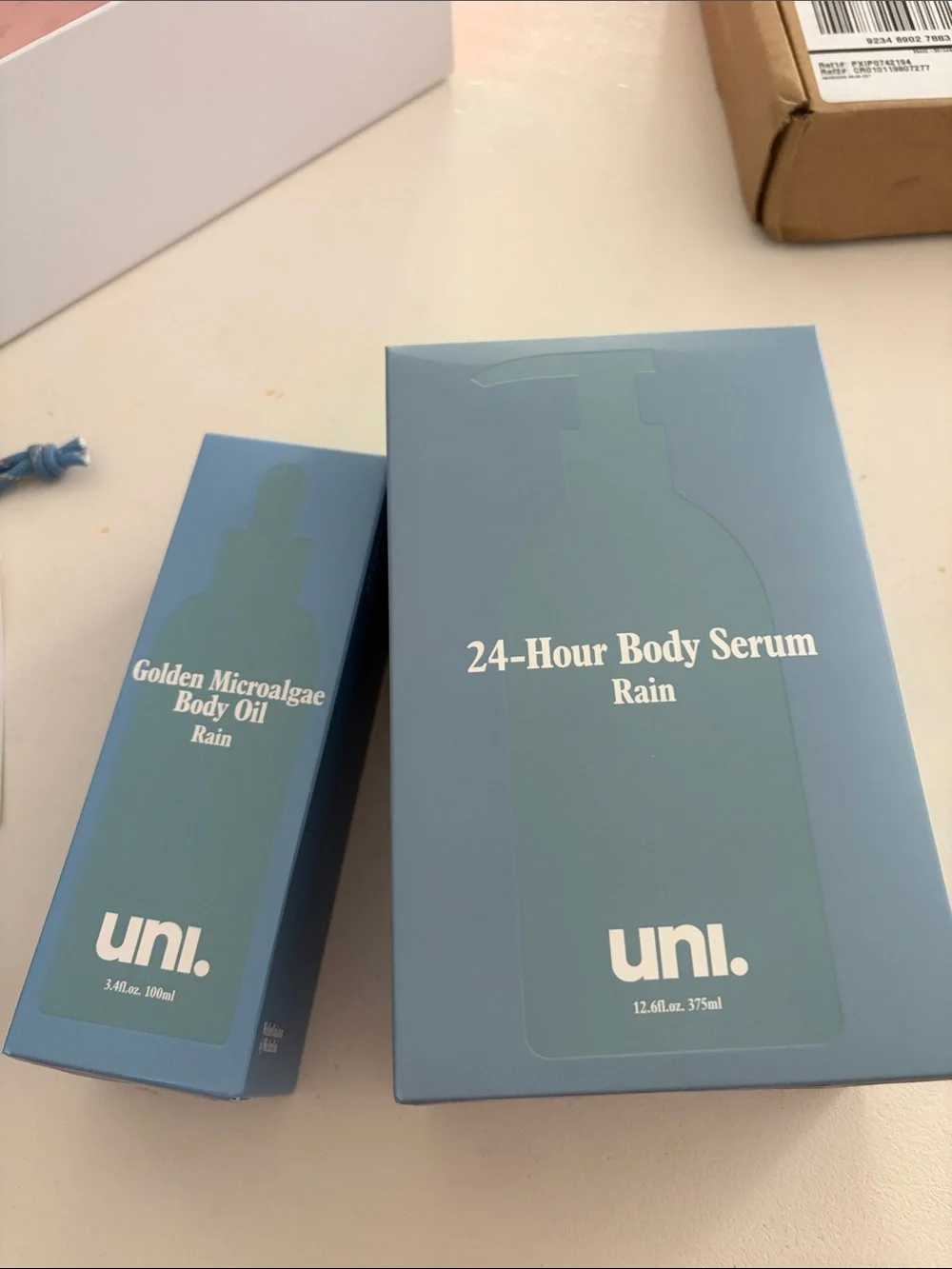 UNI rain body serum and body oil